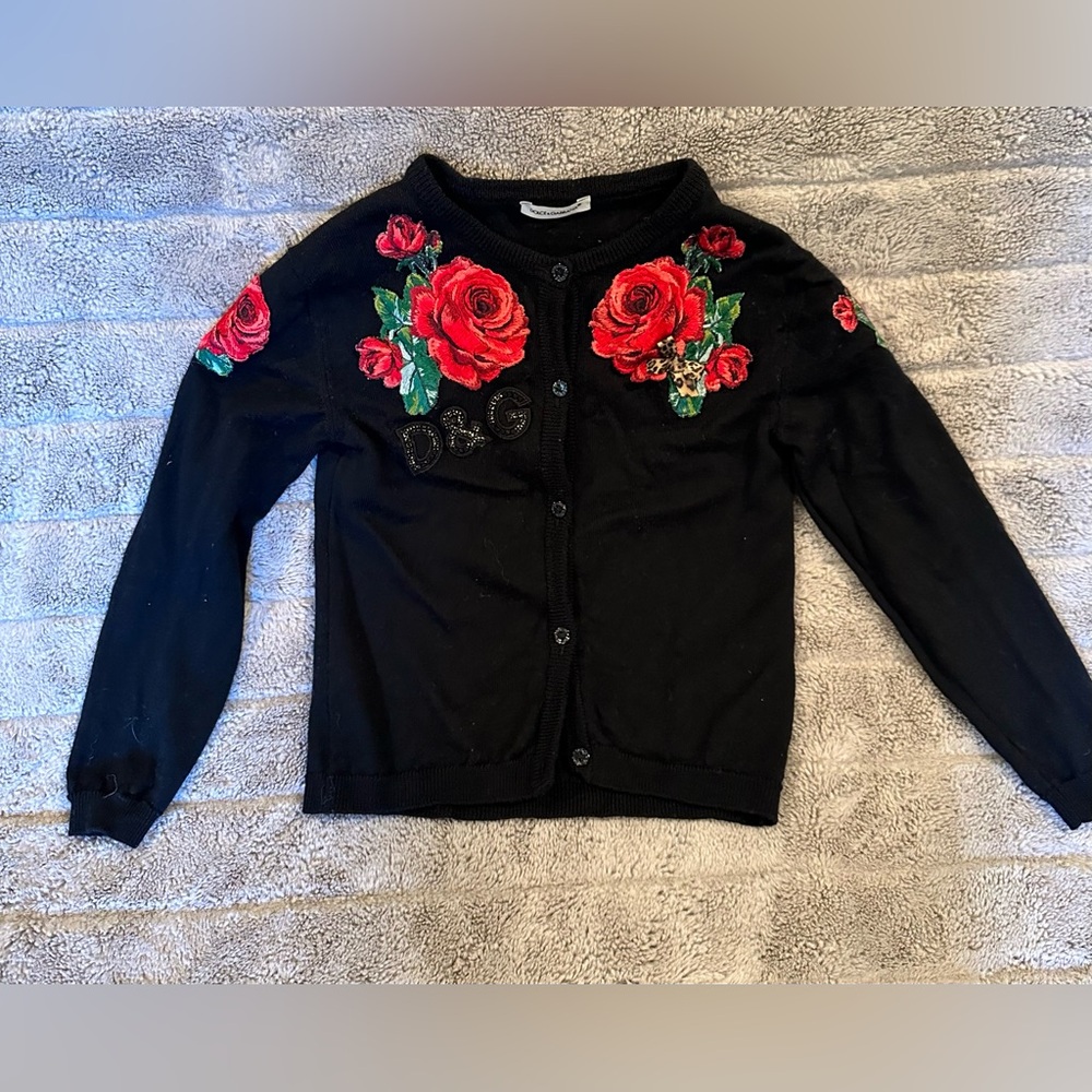 cardigan sweater with appliqué details. See matching shorts in our closet!